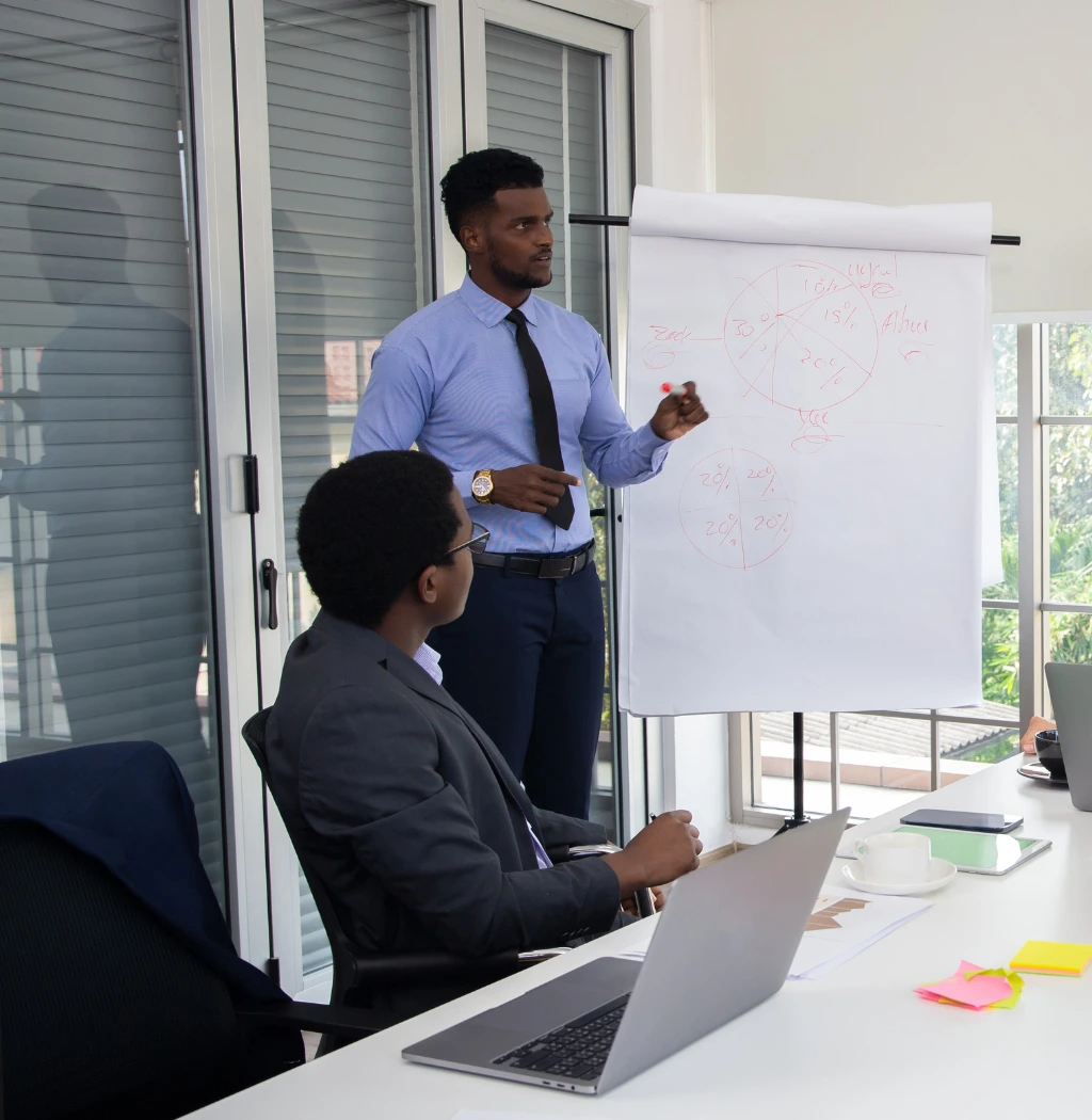 Instructor leading a professional training session with business team in a modern office